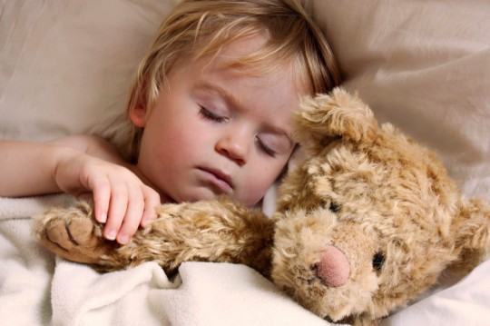 baby toddler asleep with teddy bear